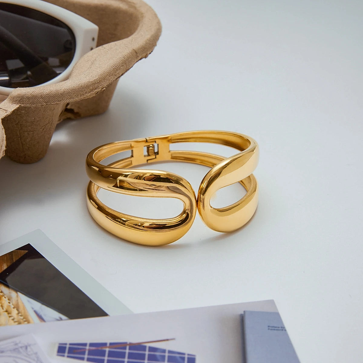 Elegant gold bracelet with a modern design showcased as everyday gold jewelry