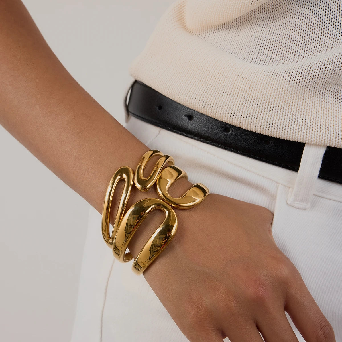 Elegant chunky gold bracelet worn on wrist showcasing stylish everyday gold jewelry