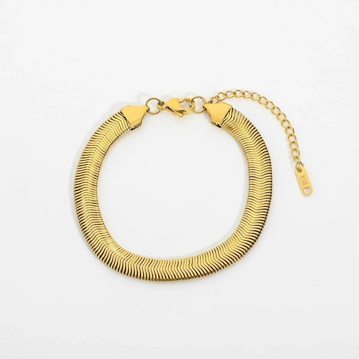 Gold stacked chain bracelet with adjustable clasp and smooth textured links