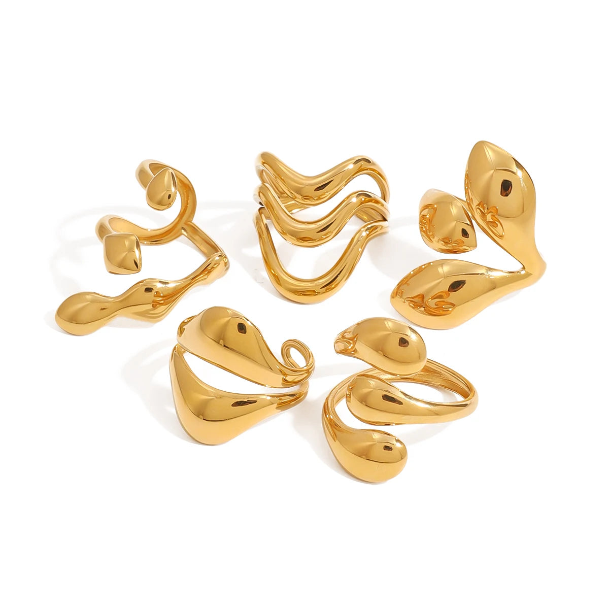 Collection of elegant statement gold rings with modern, abstract designs displayed on white background